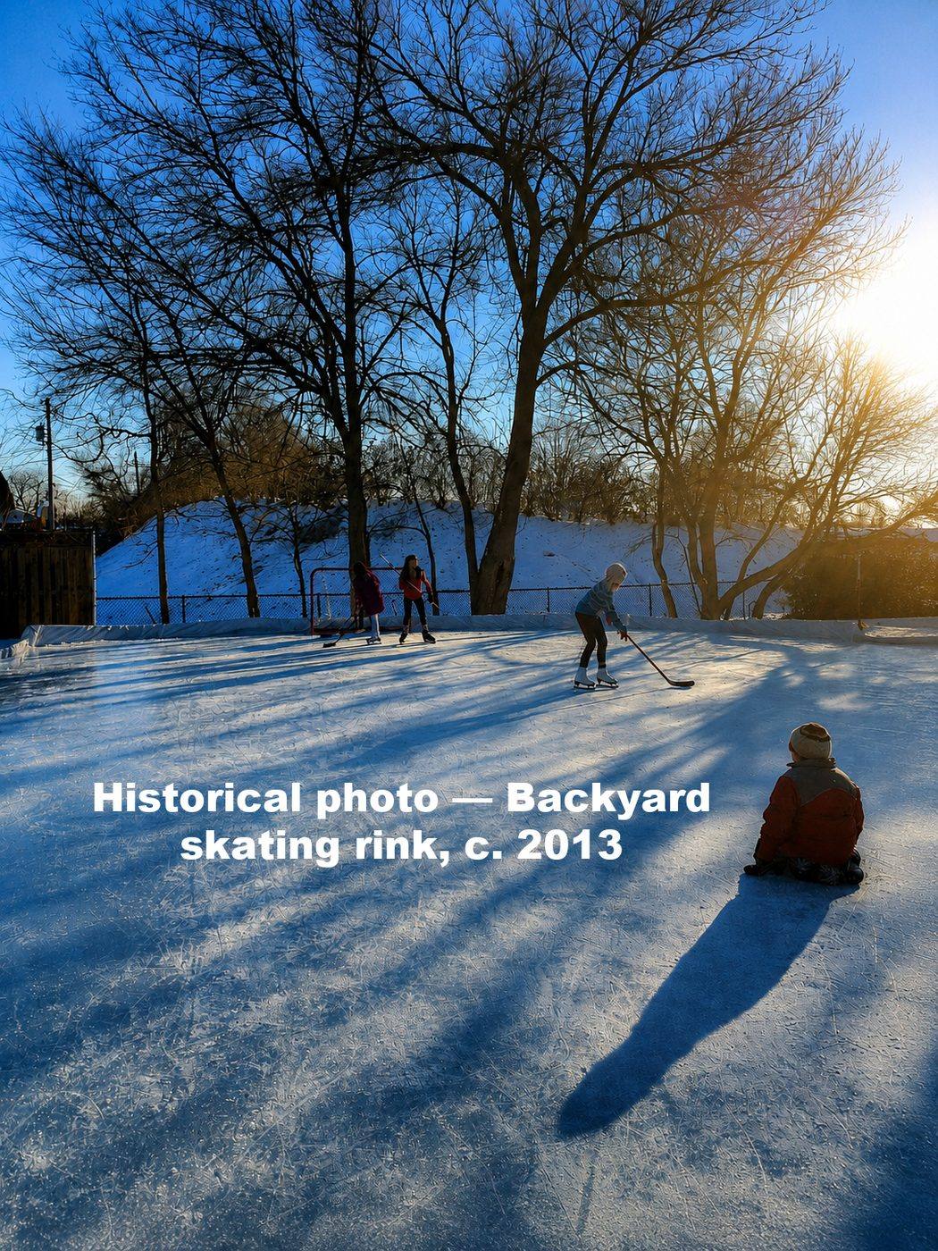 Children skating and playing hockey on a backyard ice rink at 2303 Old Glenview Road at sunset, historical photograph circa 2013