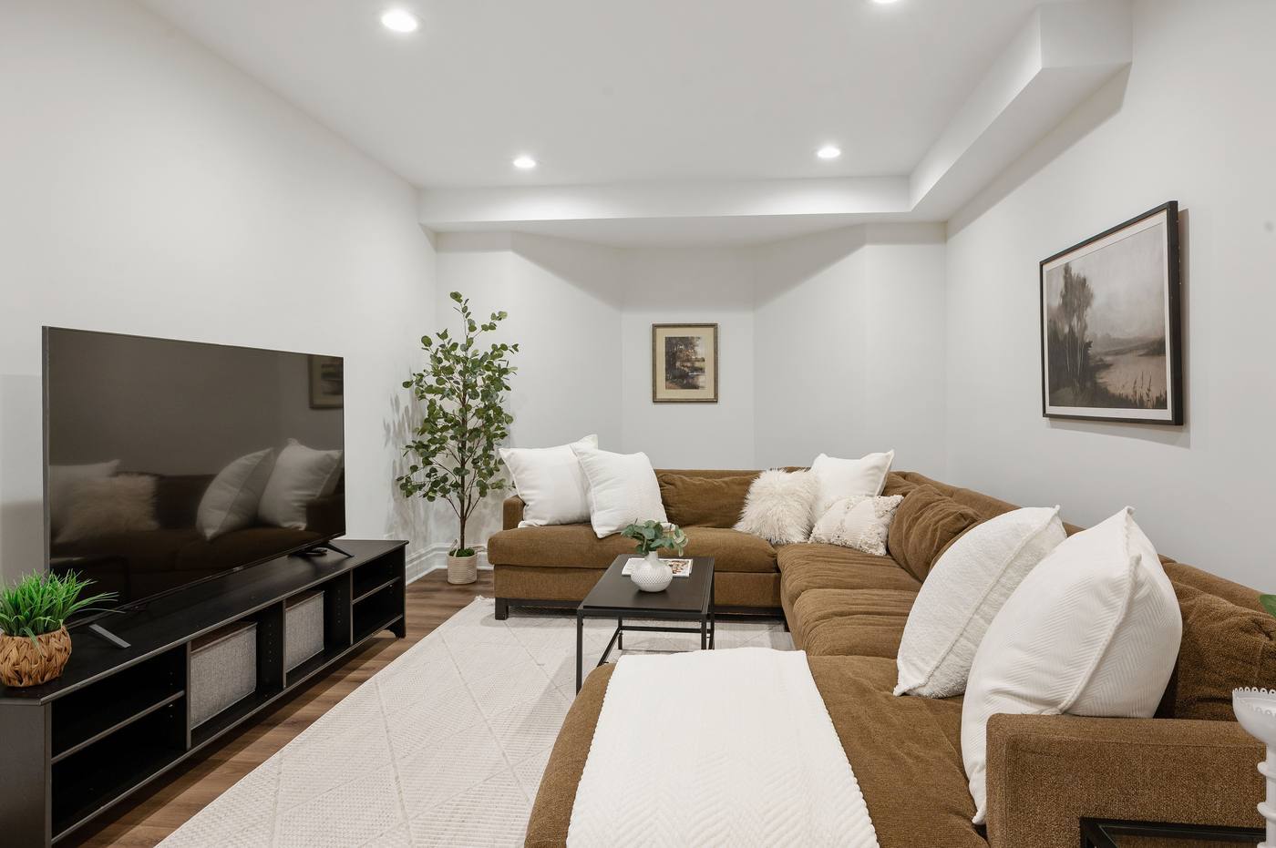 Lower-level media area with sectional seating